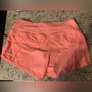 Run Times Mid Rise 4in inseam. Bright orange.